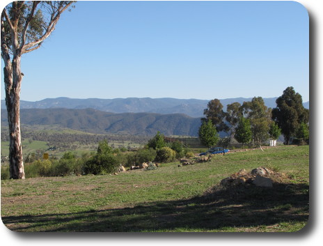 View to distant mountain ranges beyond plane