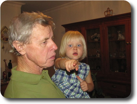 Grandfather with granddaughter in arms