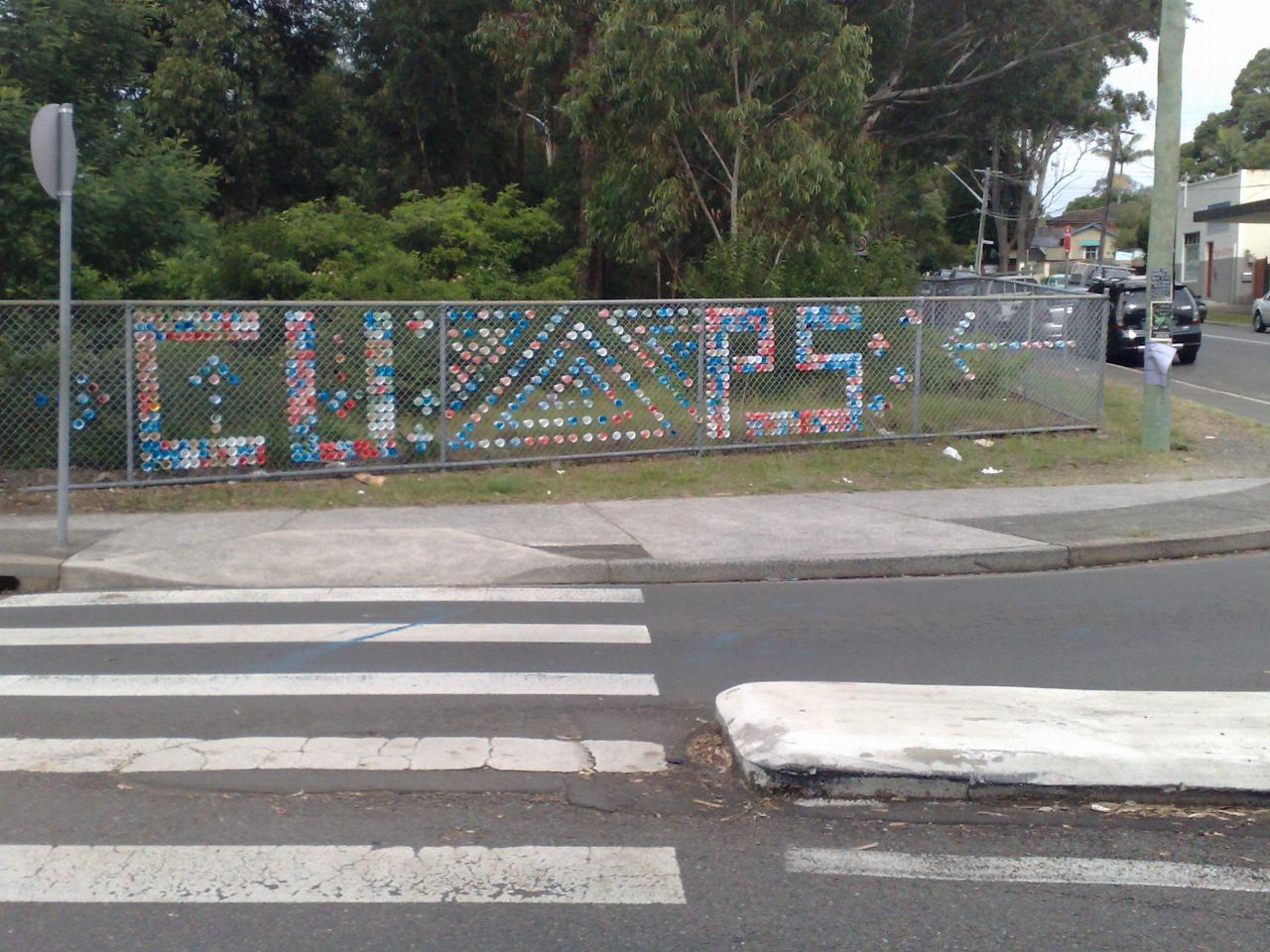 Chain link fence with coloured patches