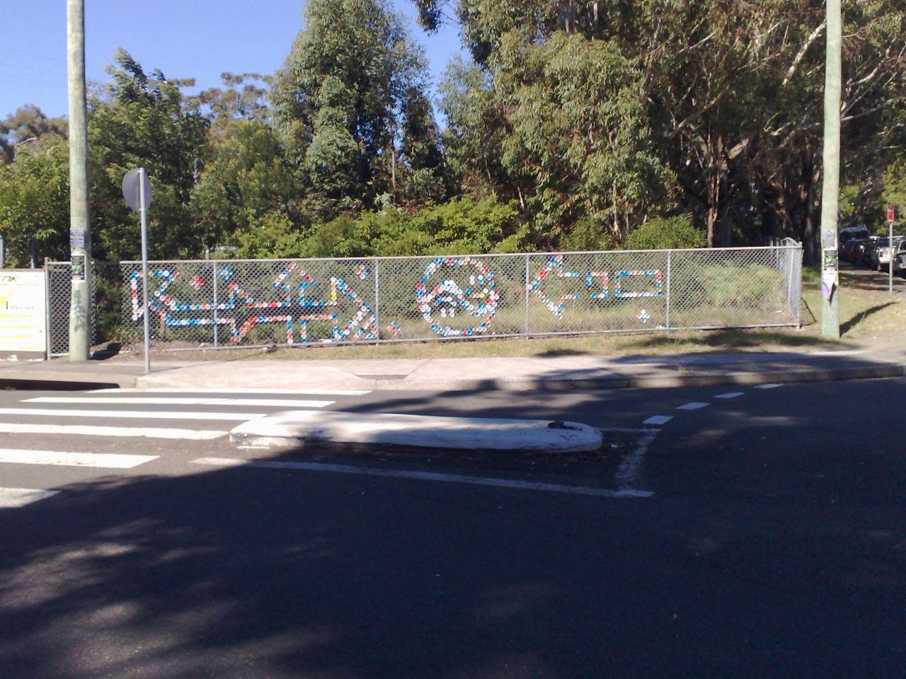 Chain link fence with coloured patches