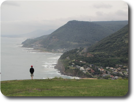 Cliffs descending to the ocean, disappearing into the mist in the distance