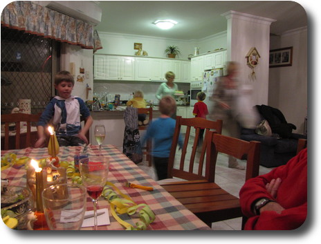 Dining table and kitchen view, with birthday cake coming to table