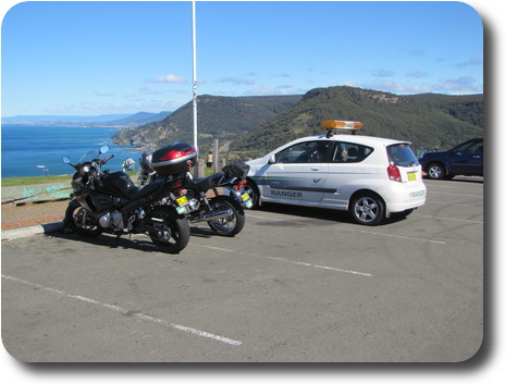 2 motorcycles overlooking the ocean