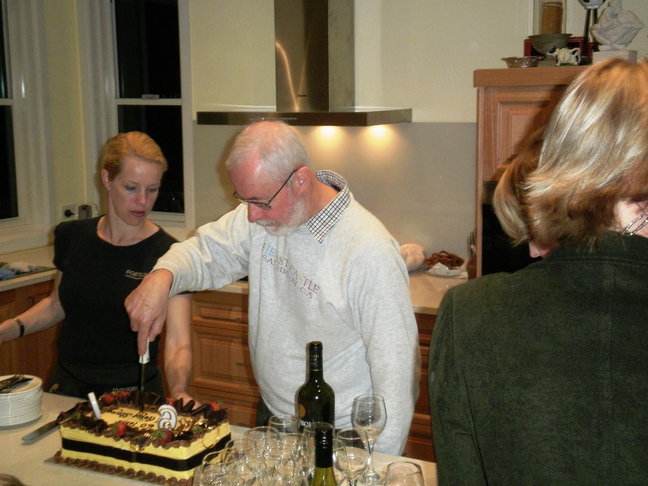 Man cutting birthday cake