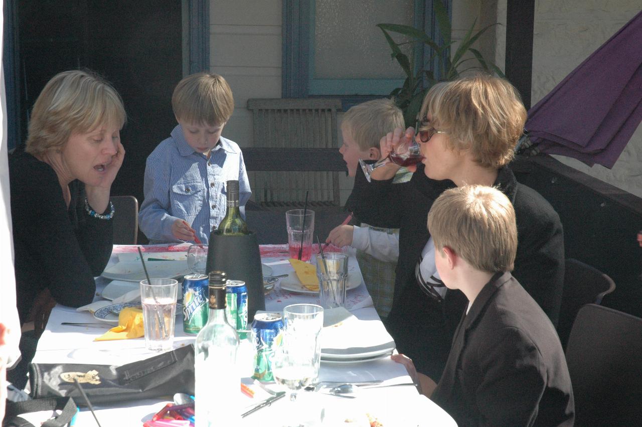 Mothers and sons at end of table