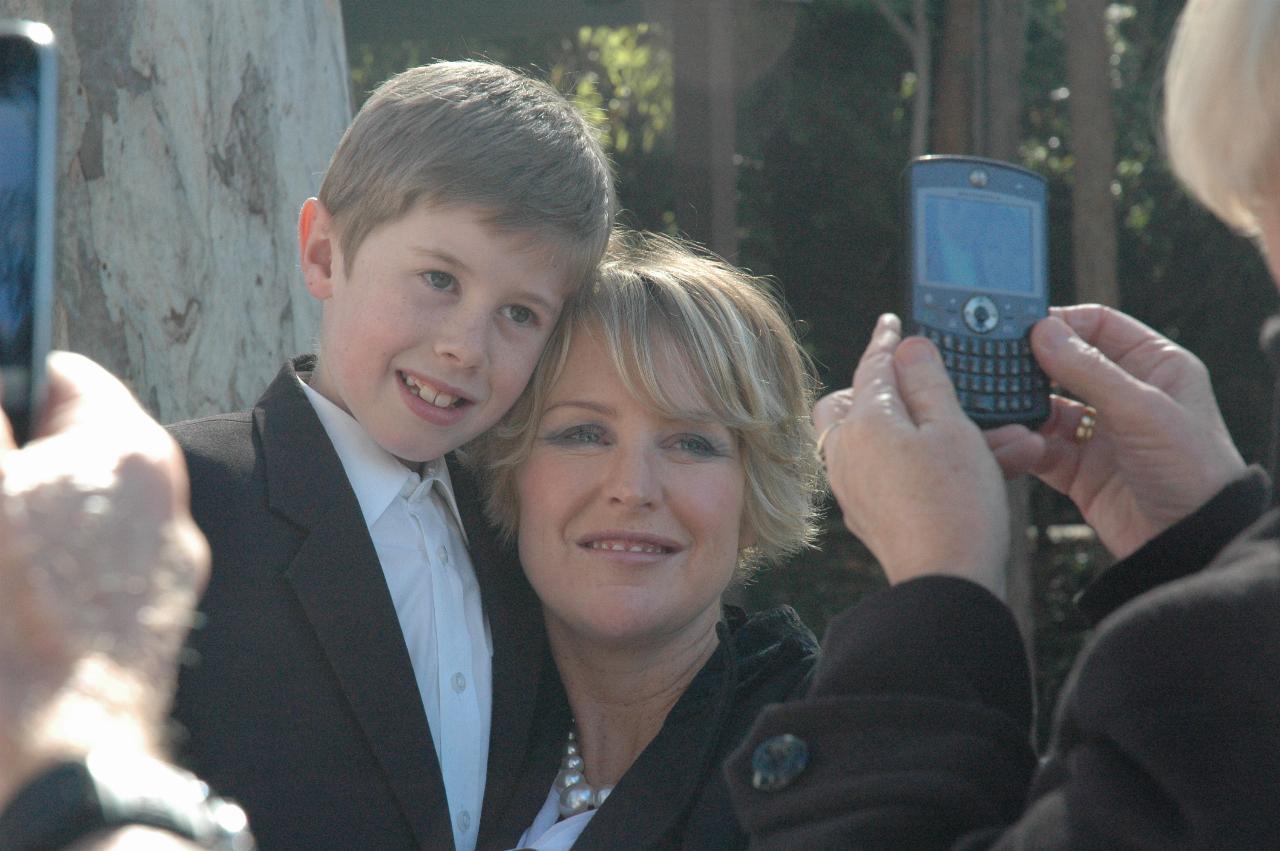 Mother and son being photographed