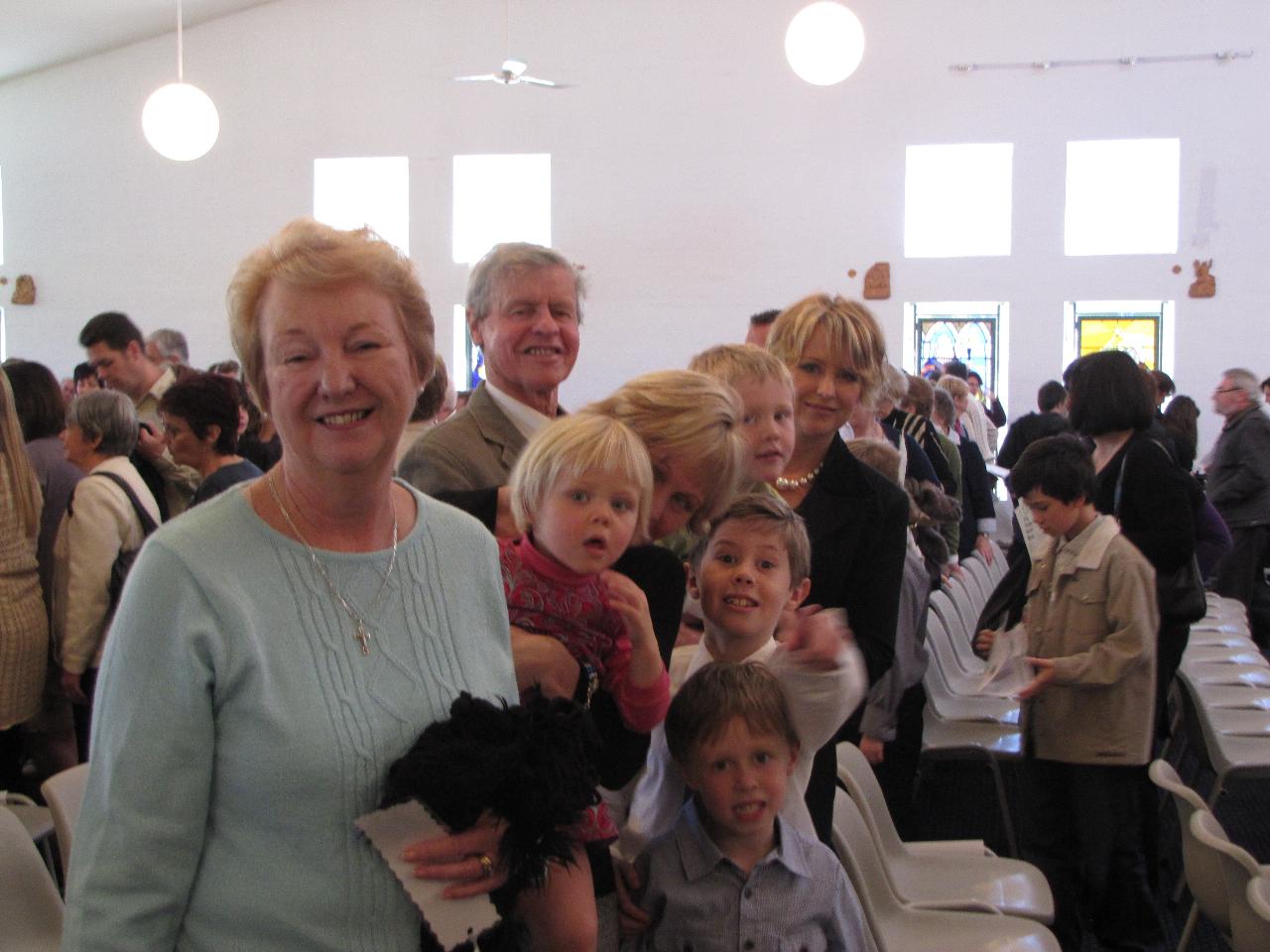 Family in church at the end of Mass