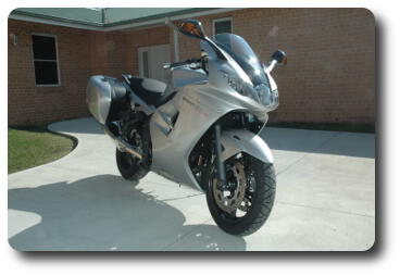 Silver/black motorcycle viewed from front right (of rider)