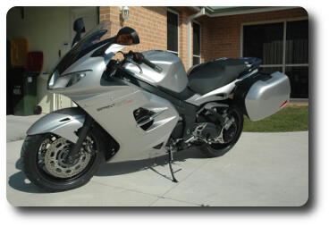 Silver/black motorcycle seen from front left (of rider)