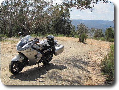 Motorcycle parked in the bush at lookout