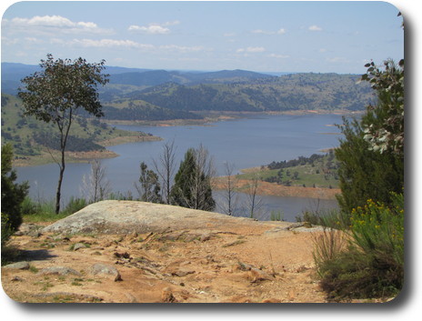 View over rock to lake, with distant hills