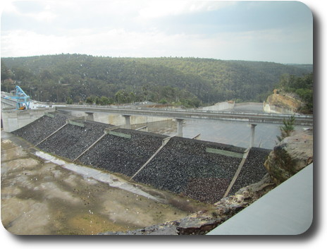 Concrete apron and gravel barrier of emergency spillway