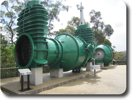 Closer view of 2 large valves, sitting on concrete display stand