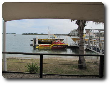 Jet boat sitting at wharf with a couple of other rescue boats