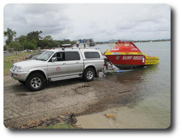 Jet boat now positioned on trailer, but still in water