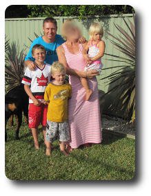 Mum,dad, two sons and daughter in garden