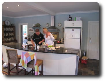 Couple in kitchen preparing a meal