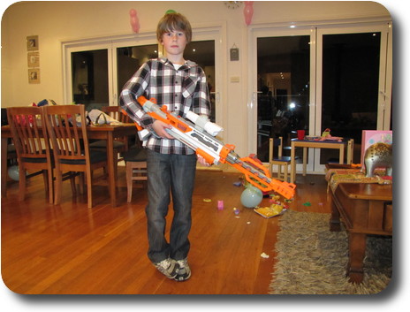 Birthday boy holding his assembled gun