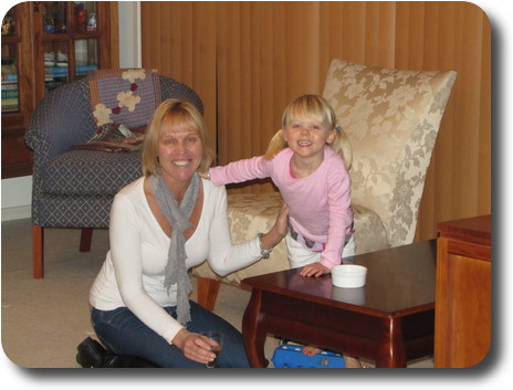 Mother on floor and daughter on adjacent chair