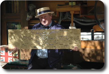 Man holding paper sheet with horizontal slots to activate the mechanism