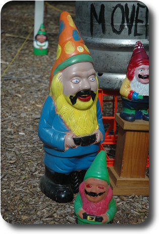 Close up of a gnome with a hand drawn moustache