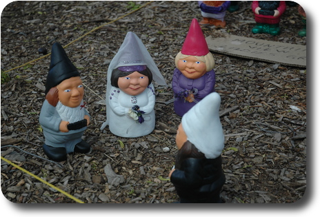 Gnomes in wedding ceremony: bridge and groom, best man and minister