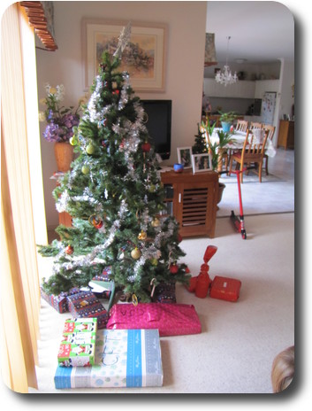 Decorated Christmas tree with presents underneath