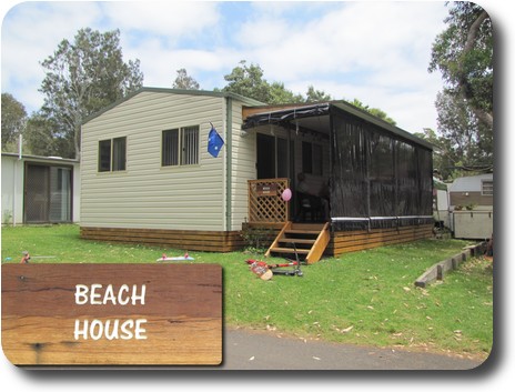 Prefabricated metal building with wooden verandah on side