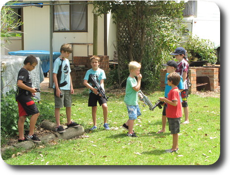 Seven boys, 10 and under, with weapons, forming teams to takethe grounds from their opponents