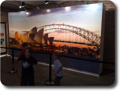 Lego mosaic showing Sydney Opera House and Harbour Bridge at sunset