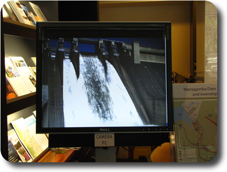 Picture of computer monitor showing water spilling down front of dam