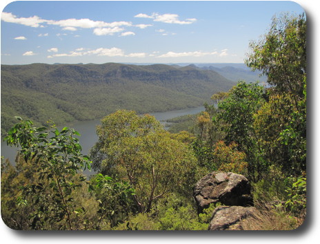 Looking downstream, with a few conical hills leading to distant mountains