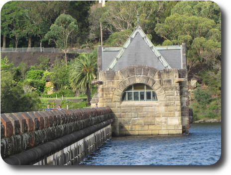 Stone building, with slate roof on upside of dam wall