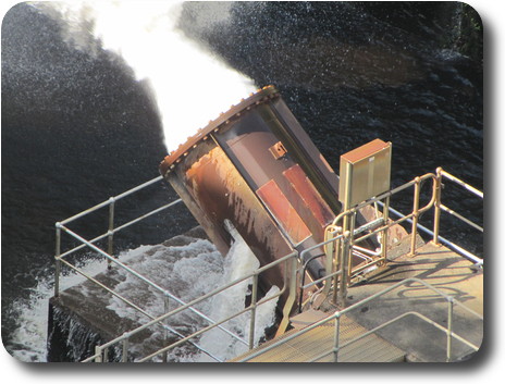 Close up of cannon style metal tube releasing water