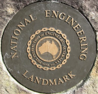 Circular plaque, labelled 