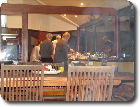 Kitchen with half a dozen people in it