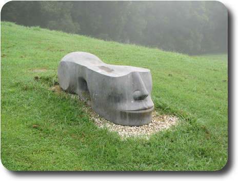 Cement lawn fixture, resembling the Egyptian Sphinx with the top half missing