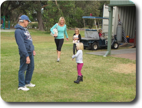 Two adults, two children on the sidelines