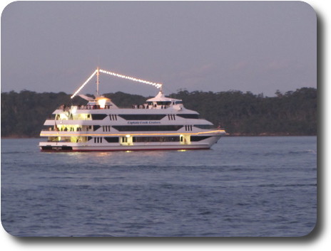 White painted modern vessel, decked out with lights