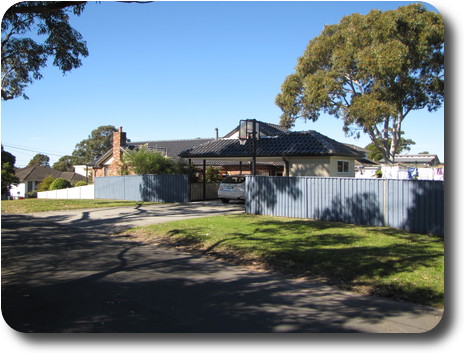 Same house, side view with carport