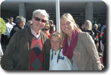 Father, daughter and her step-son outside the church