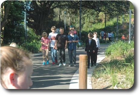 Group of boys walking towards the camera from a park