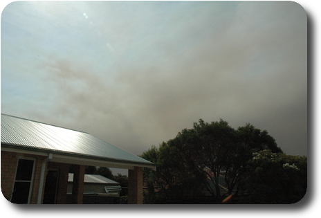 View of sky, showing dark clouds which is smoke from fires