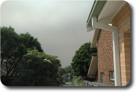 View of sky, showing dark clouds which is smoke from fires