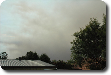 View of sky, showing dark clouds which is smoke from fires