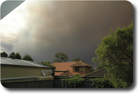 View of sky, showing dark clouds which is smoke from fires