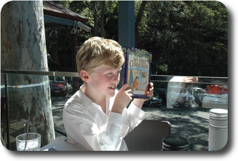 Boy holding up book