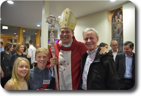 Lily, Cooper, Bishop Umbers and Peter in foyer of church after Confirmation