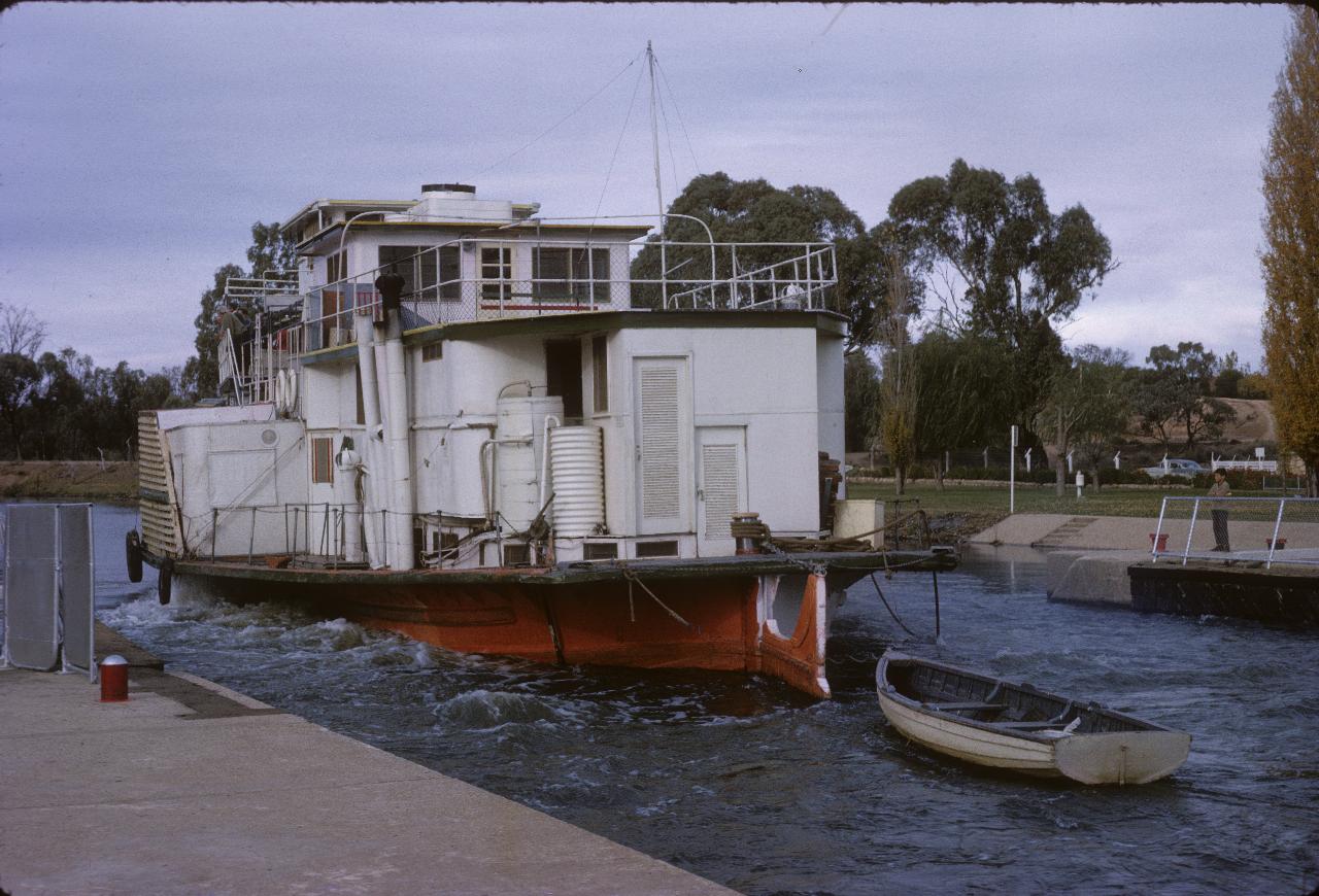 Rear view of paddle wheeler exiting the lock