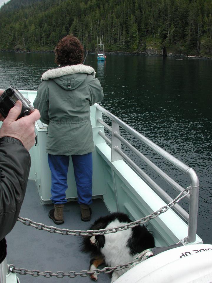 Captain Nina and her dog Phrater at the helm as we approach the disabled boat